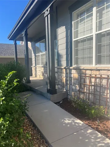 a view of house with backyard