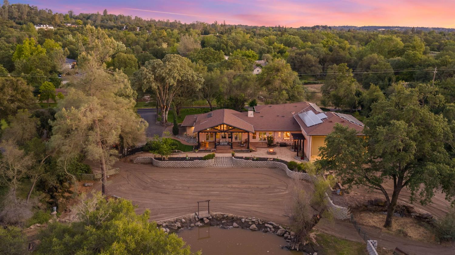 7021 Horseshoe Bar Road Loomis, CA 95650 - Photo 77 of 77 Aerial view showcasing the home's private setting, pond, and natural landscape.
