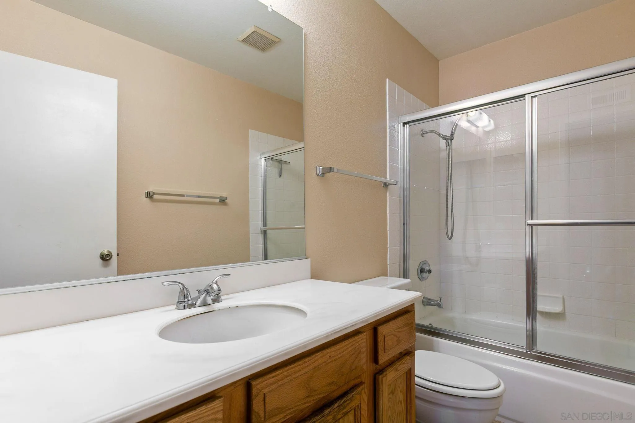 4468 Inverness Drive Oceanside, CA 92057 - Photo 18 of 29 a bathroom with a granite countertop sink toilet and shower