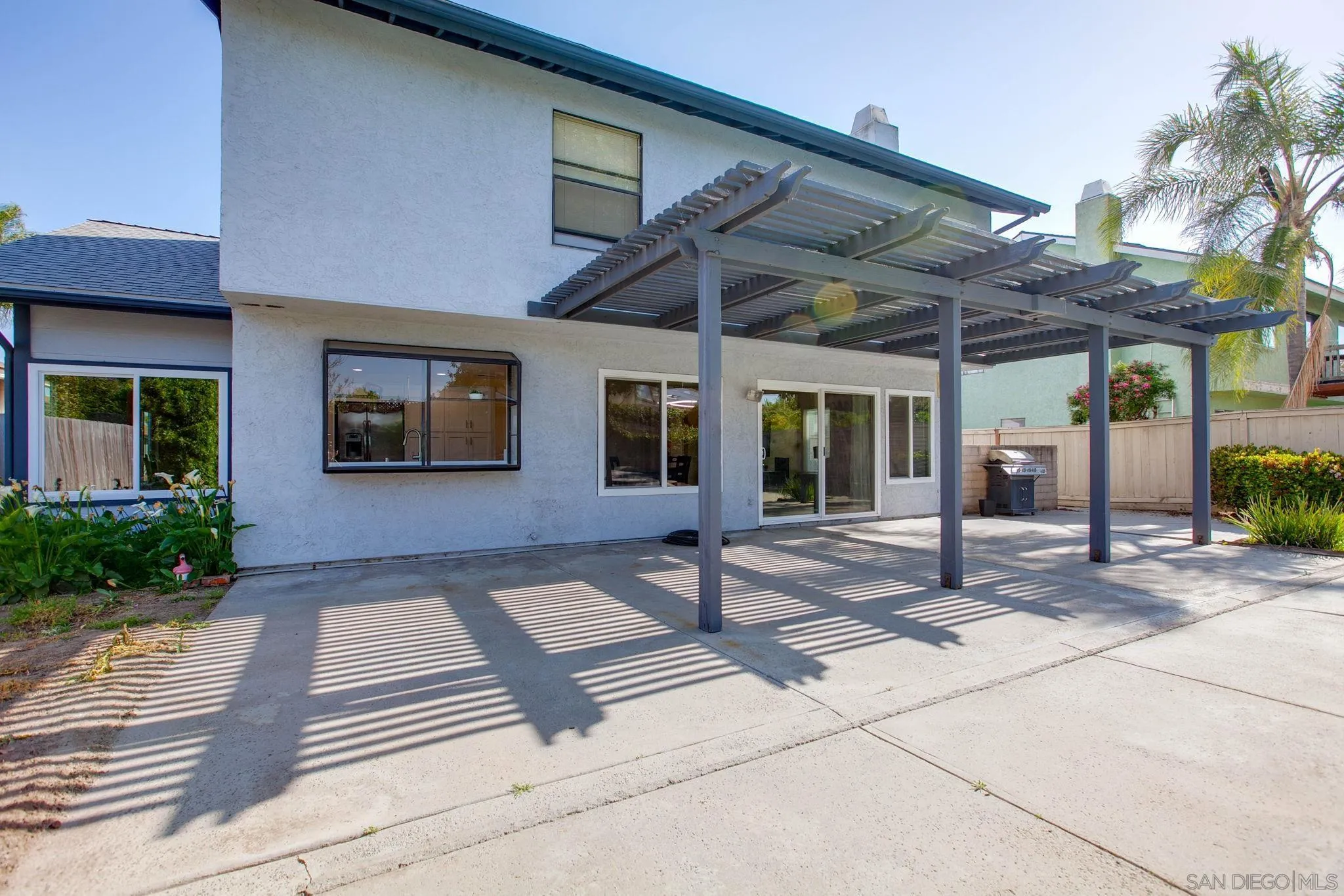 4468 Inverness Drive Oceanside, CA 92057 - Photo 25 of 29 a view of house with backyard and glass windows