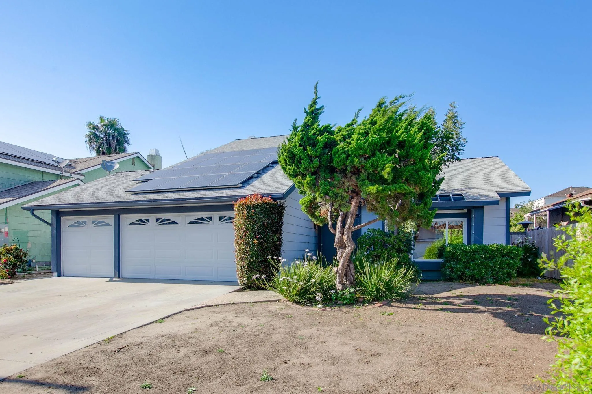 4468 Inverness Drive Oceanside, CA 92057 - Photo 28 of 29 a front view of a house with a yard and a garage