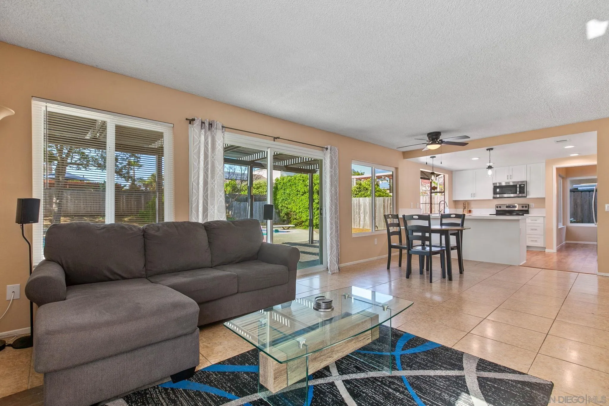 4468 Inverness Drive Oceanside, CA 92057 - Photo 6 of 29 a living room with furniture and a large window