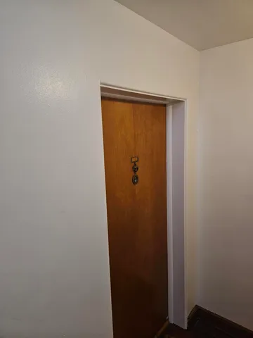 a kitchen with granite countertop a sink cabinets and stainless steel appliances