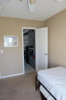 a bathroom with a sink toilet and mirror