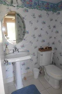 storage and utility room with two washing machine