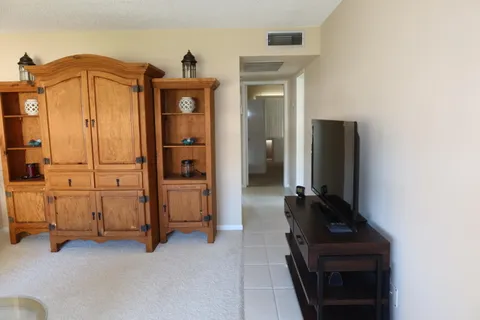 a view of a dining room with furniture and window