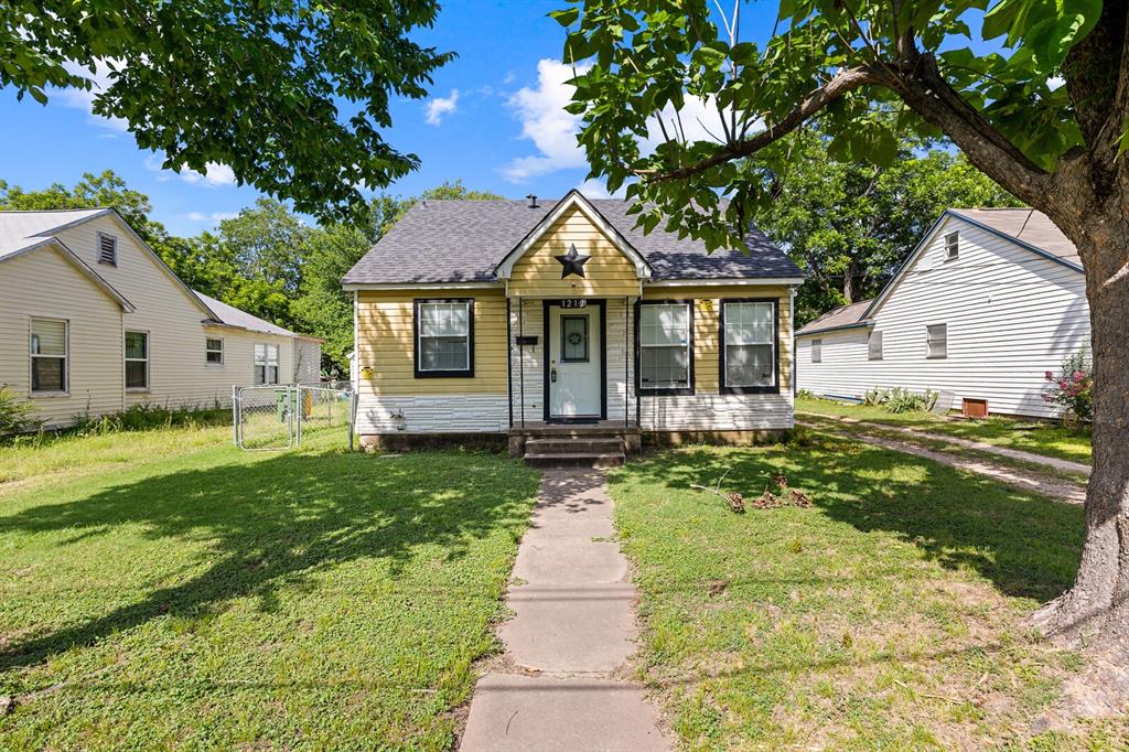 1212 Lewis Street Waco, TX 76705 - Photo 1 of 12 a front view of house with yard and green space