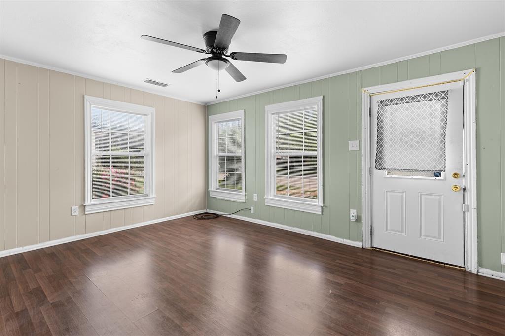 1212 Lewis Street Waco, TX 76705 - Photo 5 of 12 a view of wooden floor and windows in a room