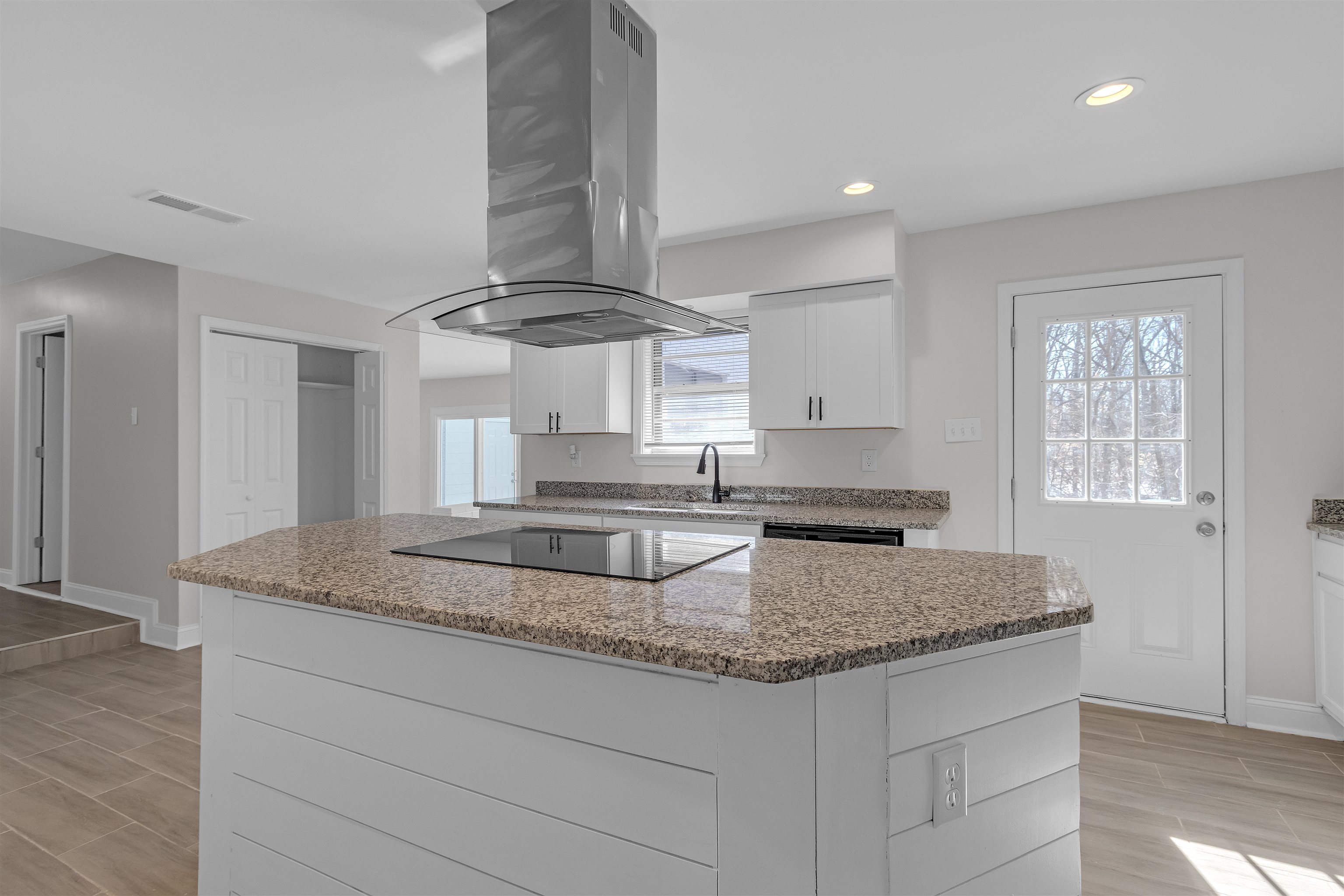 1296 Monasco Road Millington, TN 38053 - Photo 12 of 32 a kitchen with stainless steel appliances granite countertop a sink and a granite counter tops