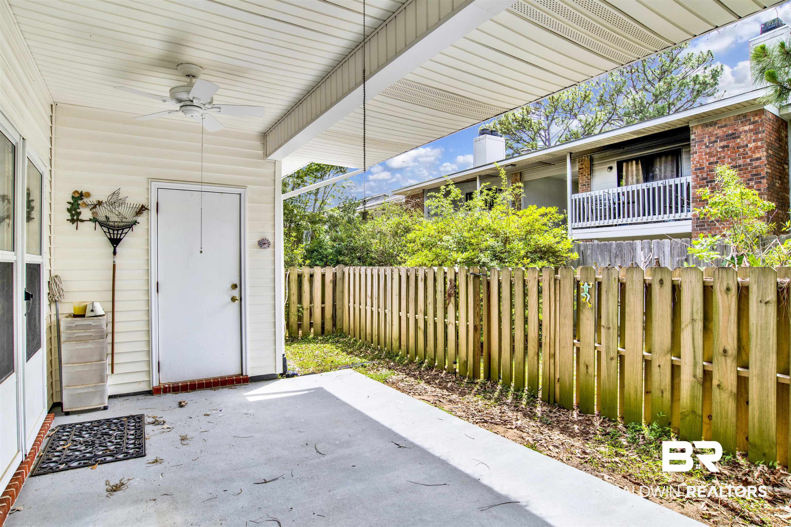 1258 Sutton Court, Unit 4 Mobile, AL 36609 - Photo 19 of 19 View of patio featuring ceiling fan and a fenced backyard