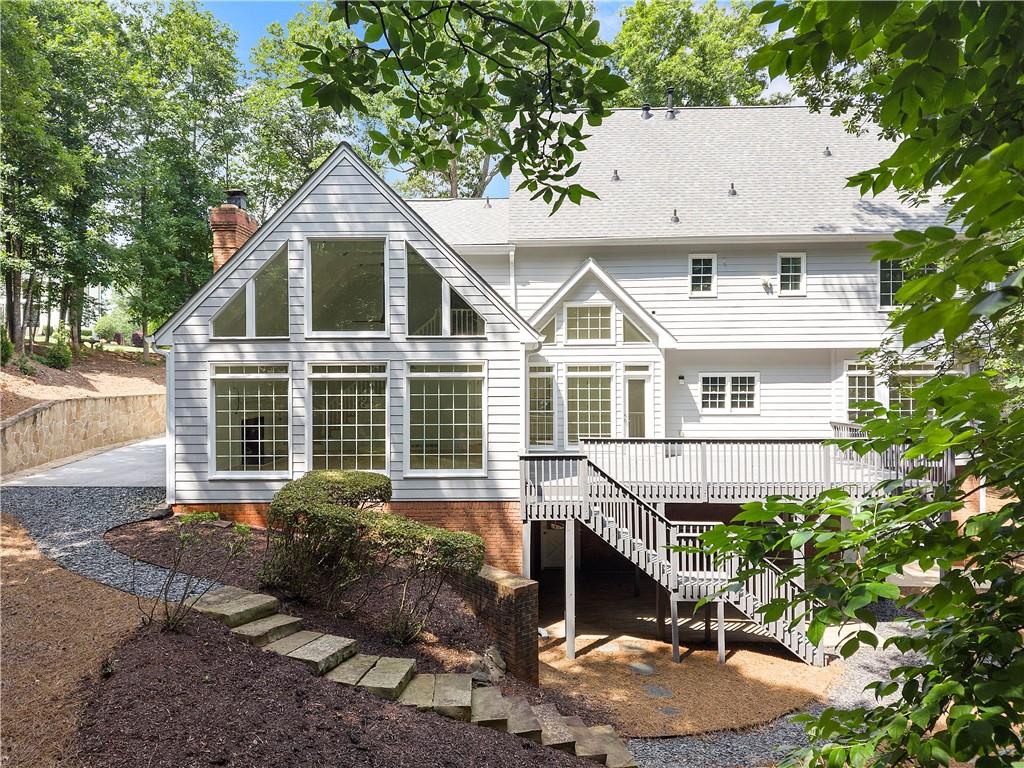 8965 Laurel Way Alpharetta, GA 30022 - Photo 55 of 79 a front view of a house with a yard