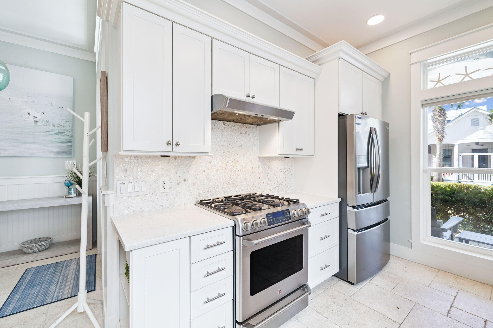 83 Eastern Lake Court Santa Rosa Beach, FL 32459 - Photo 11 of 40 a kitchen with stainless steel appliances granite countertop a stove a refrigerator and a cabinets