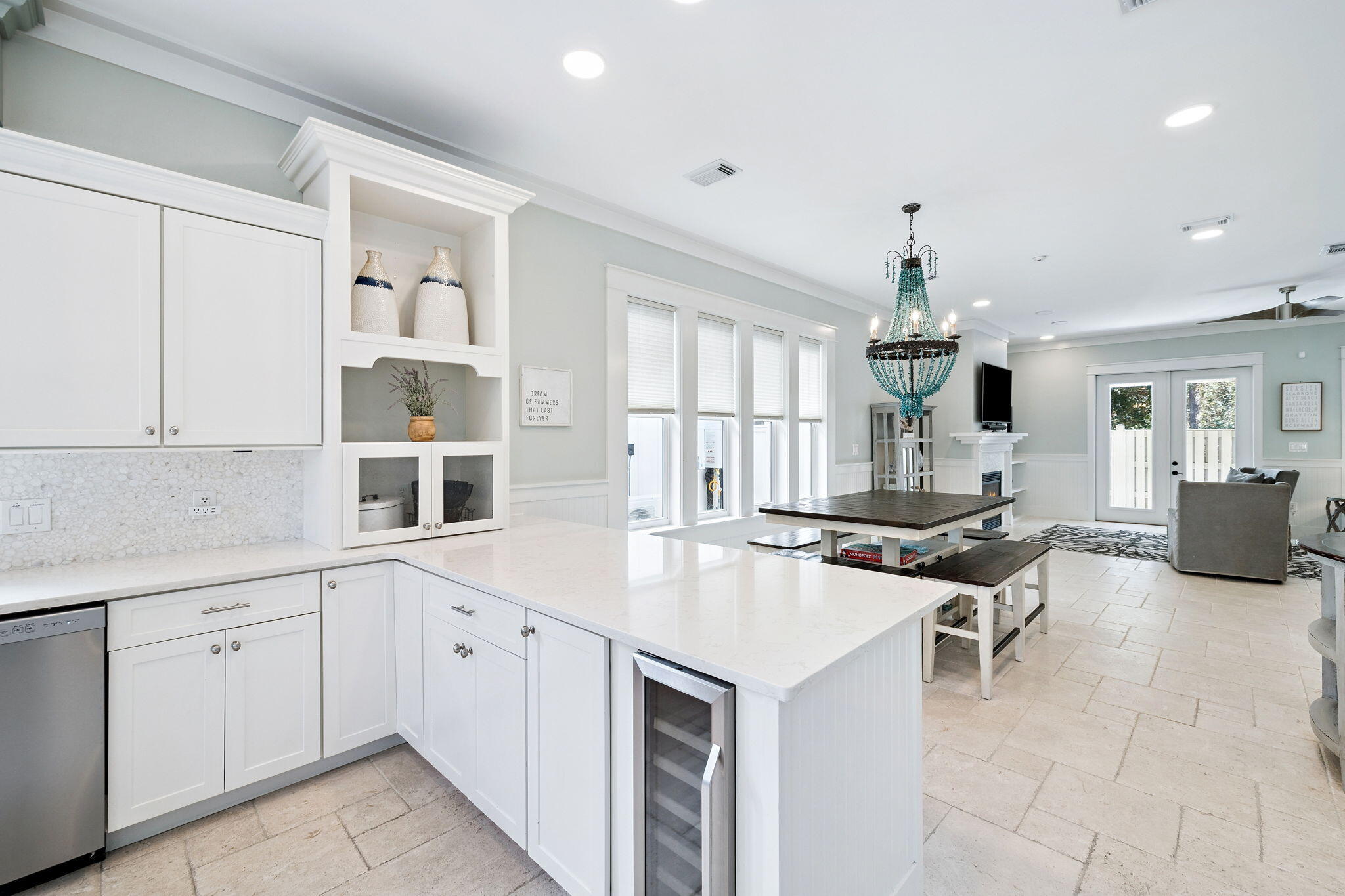 83 Eastern Lake Court Santa Rosa Beach, FL 32459 - Photo 12 of 40 a kitchen with a sink dishwasher white cabinets and couches with wooden floor