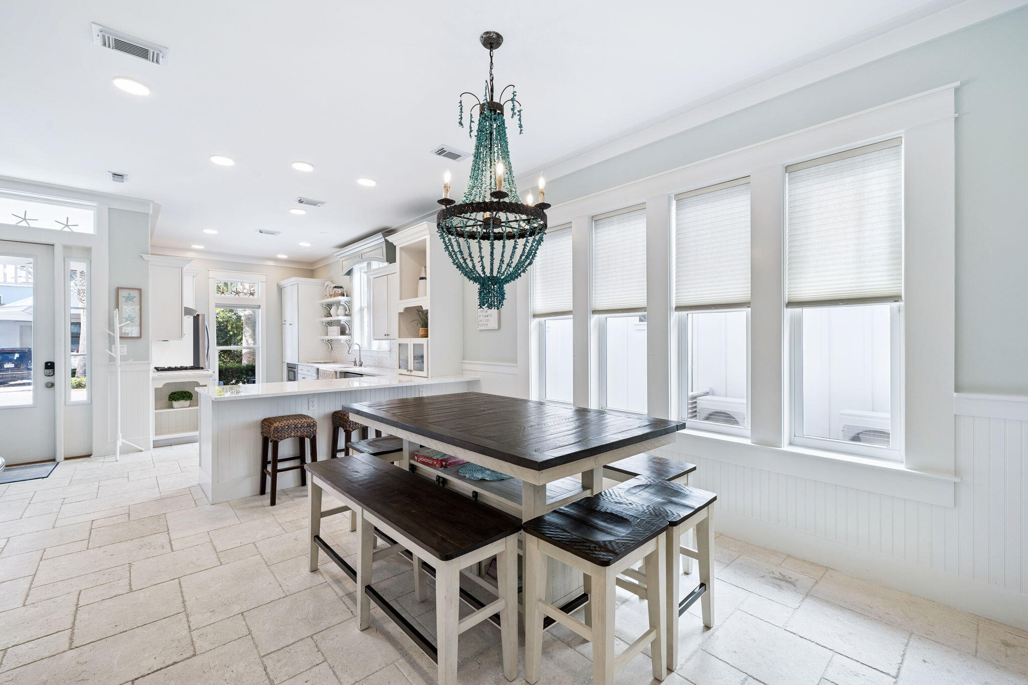 83 Eastern Lake Court Santa Rosa Beach, FL 32459 - Photo 14 of 40 a kitchen with stainless steel appliances a table chairs and a window