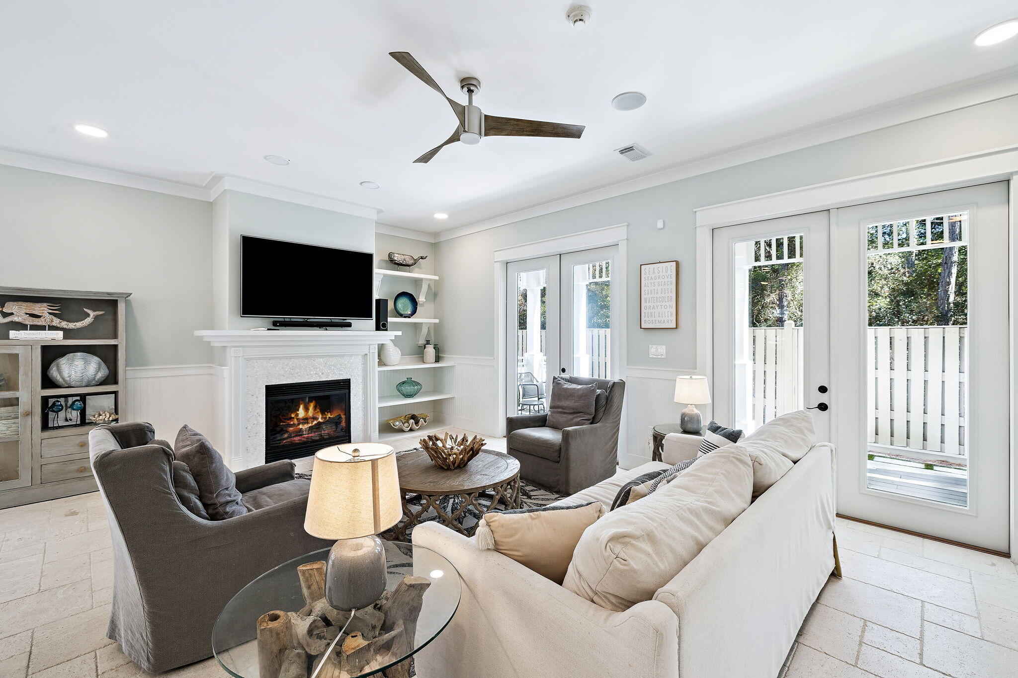 83 Eastern Lake Court Santa Rosa Beach, FL 32459 - Photo 15 of 40 a living room with furniture a flat screen tv and a fireplace
