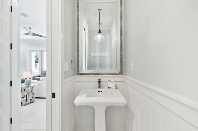 a bedroom with a bed a table and chair