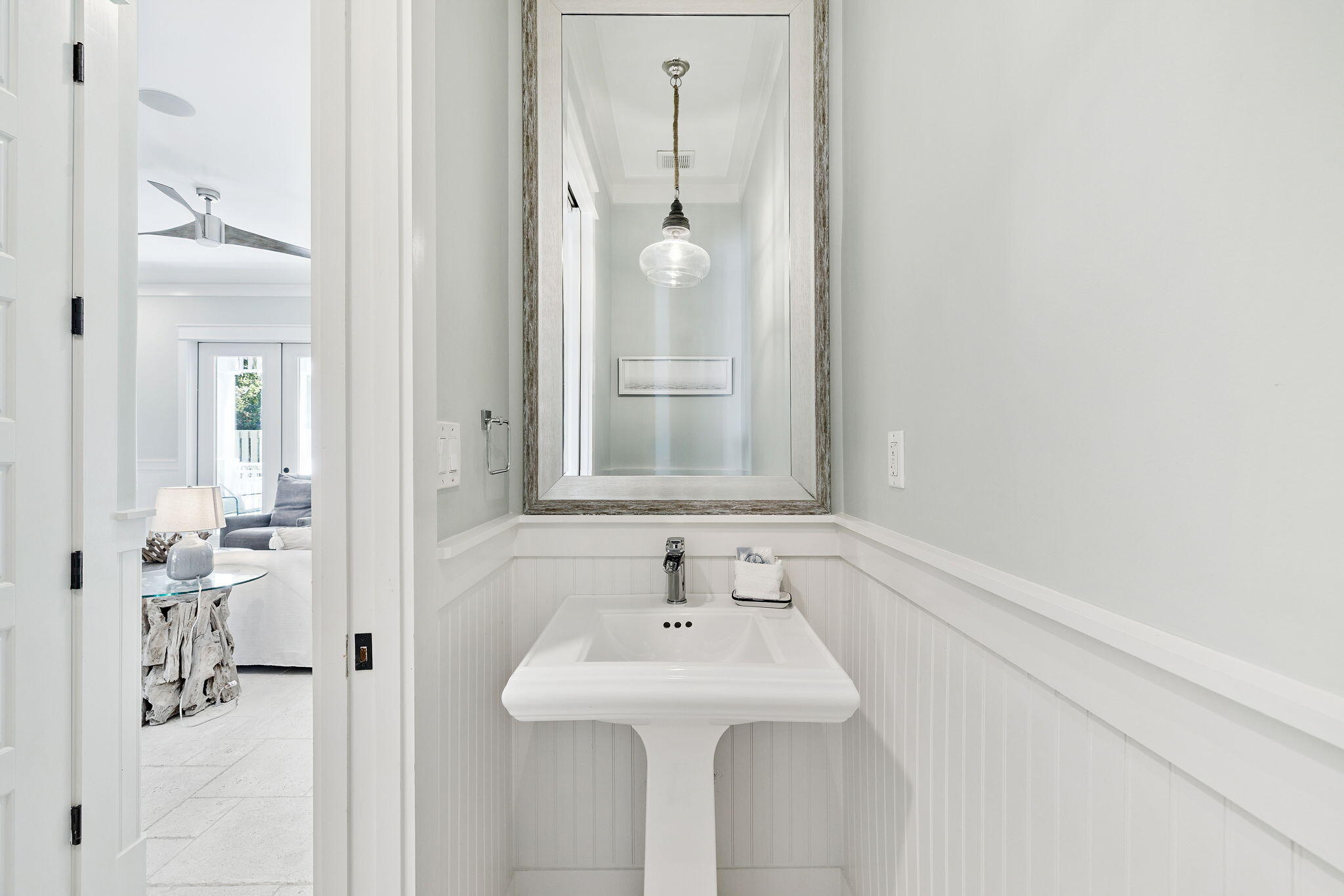 83 Eastern Lake Court Santa Rosa Beach, FL 32459 - Photo 17 of 40 a bathroom with a sink and mirror with toilet