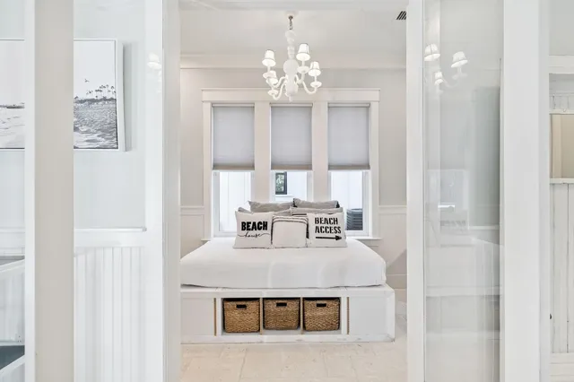 a bedroom with a bed and a table in it