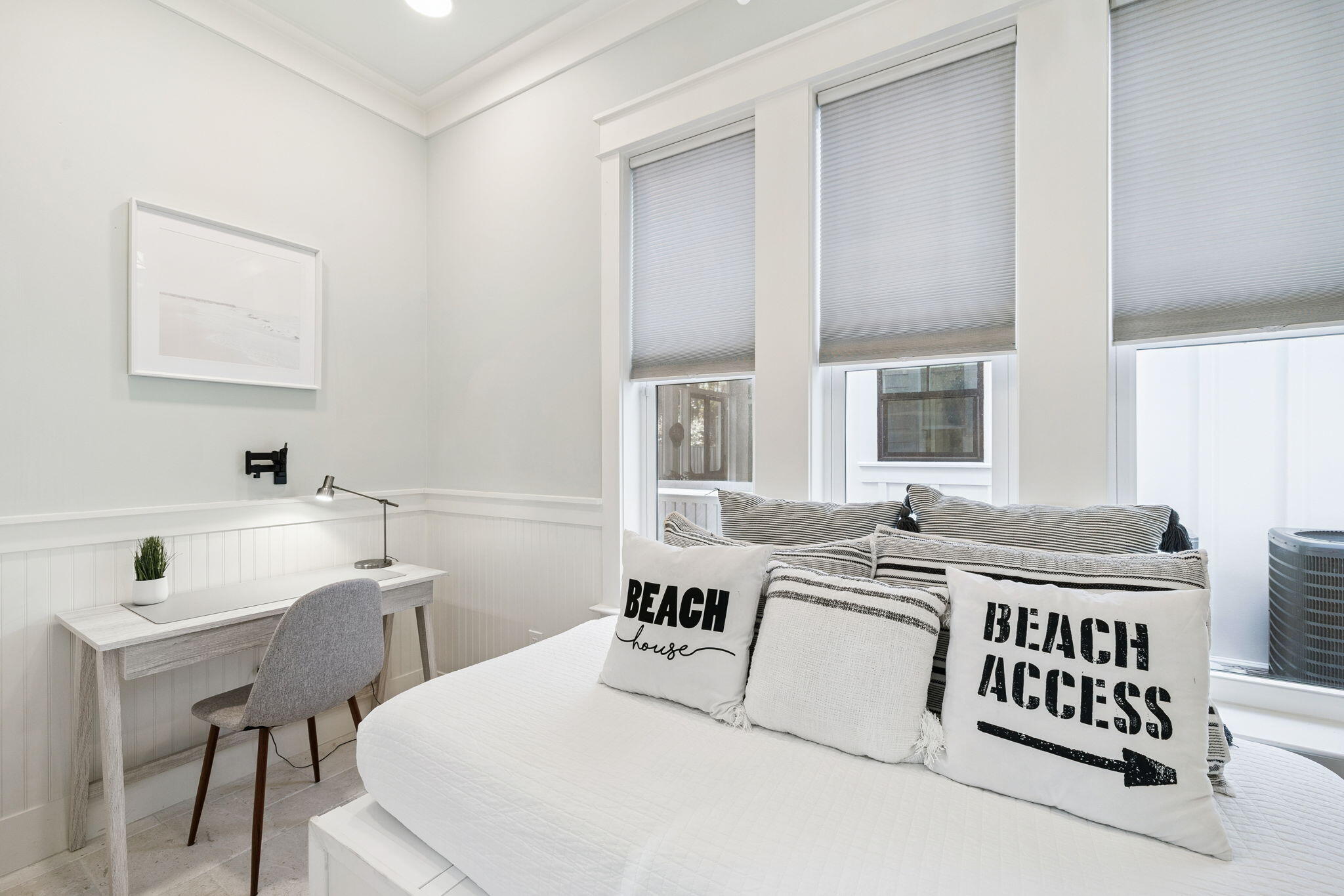 83 Eastern Lake Court Santa Rosa Beach, FL 32459 - Photo 19 of 40 a bedroom with a bed a table and chair