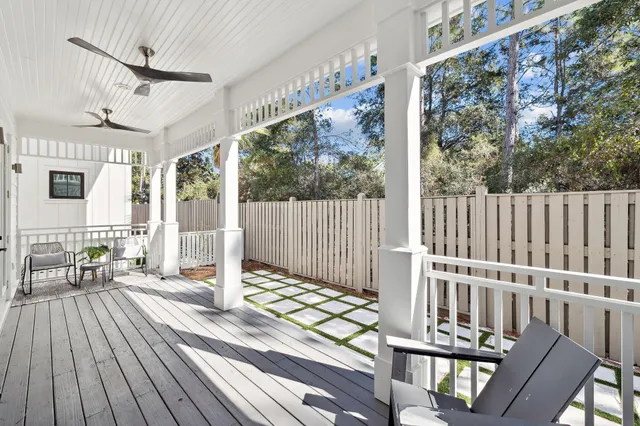 a bedroom with a bed couch and a window