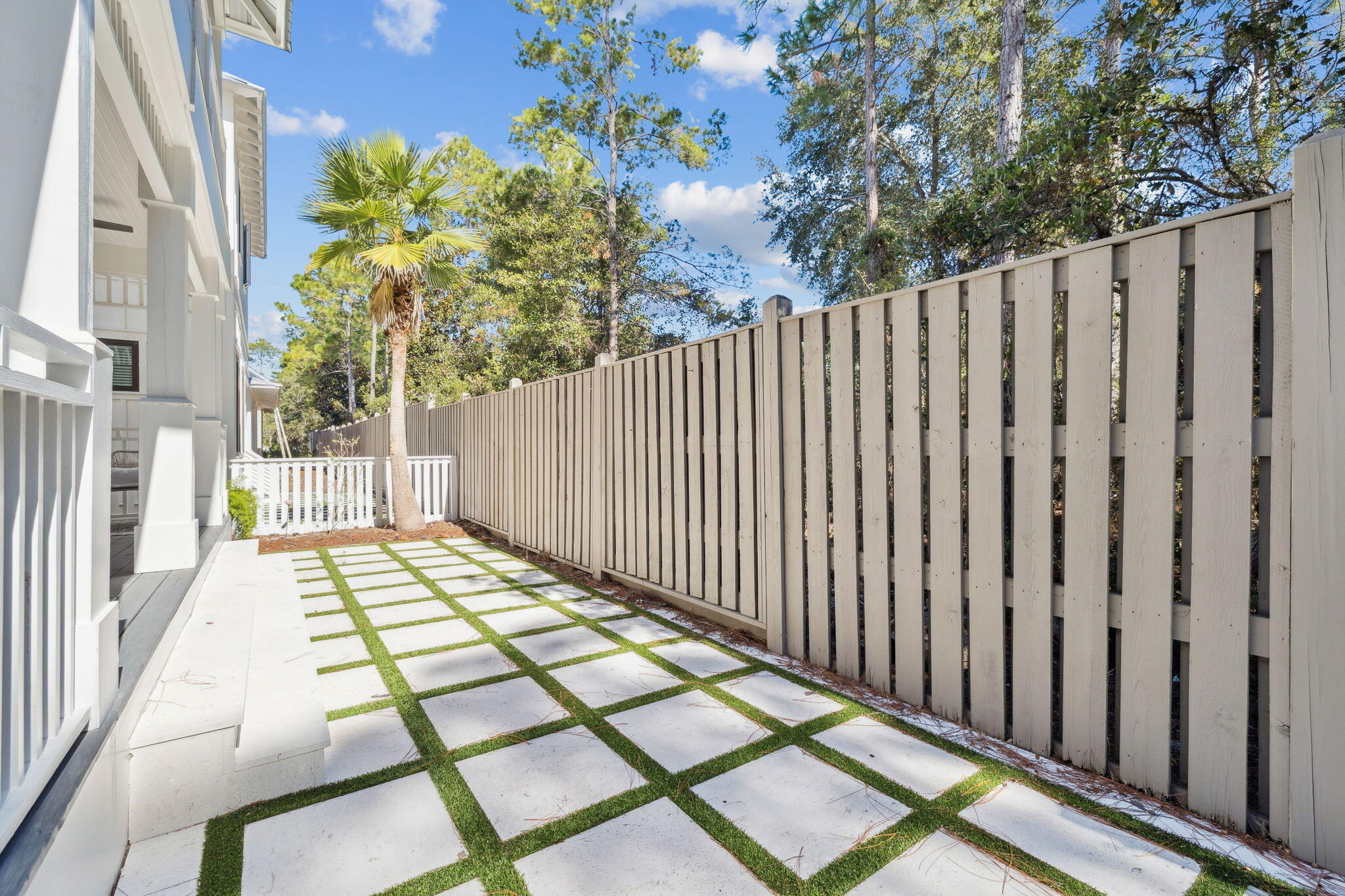 83 Eastern Lake Court Santa Rosa Beach, FL 32459 - Photo 22 of 40 a balcony with trees in front of it