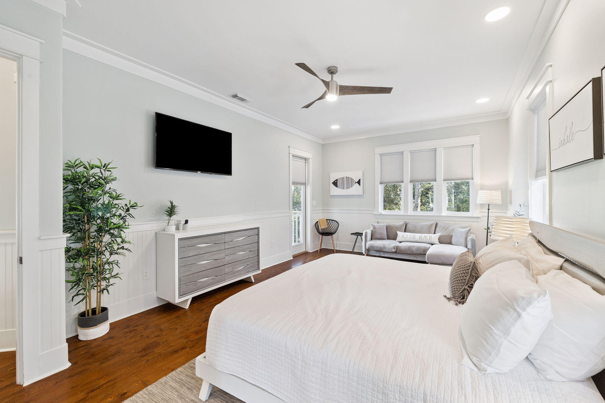 83 Eastern Lake Court Santa Rosa Beach, FL 32459 - Photo 24 of 40 a bedroom with a bed a flat screen tv and a couch