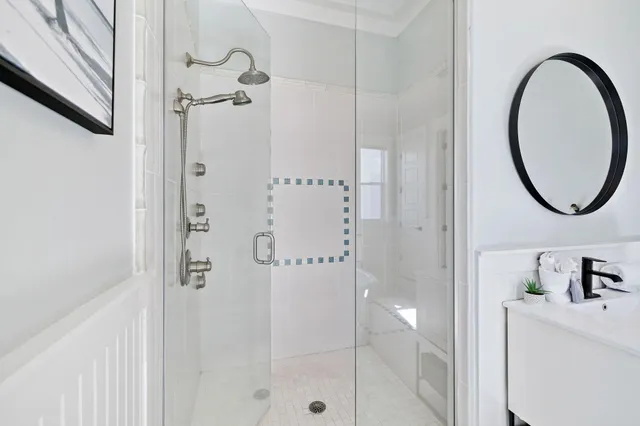 a spacious bedroom with a bed and a flat screen tv