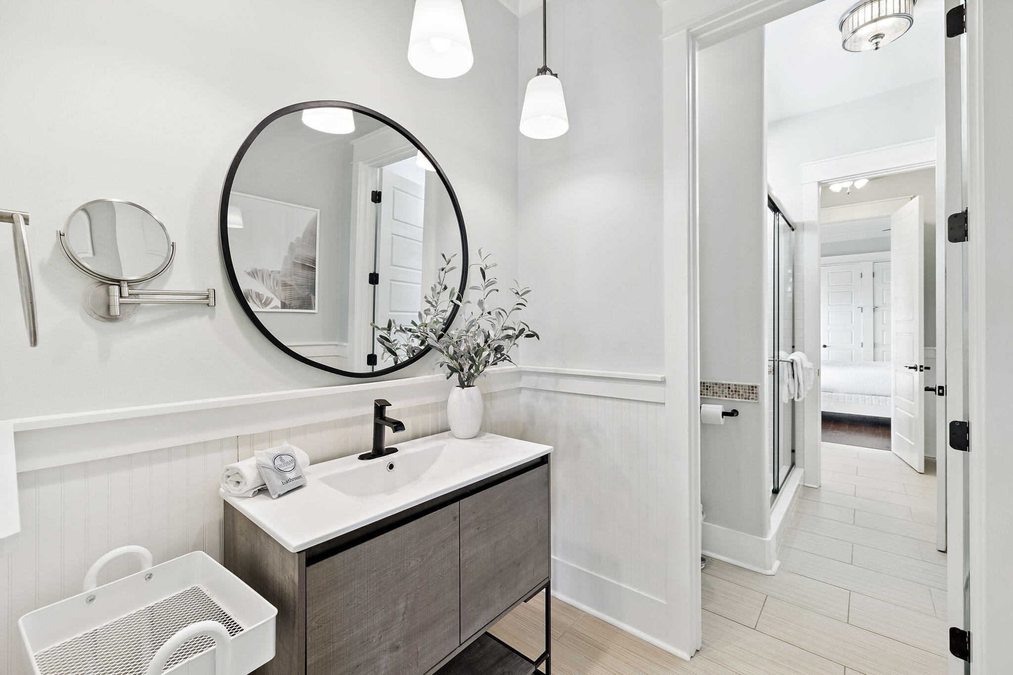 83 Eastern Lake Court Santa Rosa Beach, FL 32459 - Photo 34 of 40 a bathroom with a sink a mirror and a shower