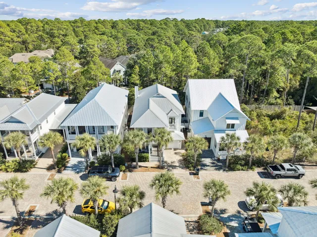 a view of house with yard and outdoor seating
