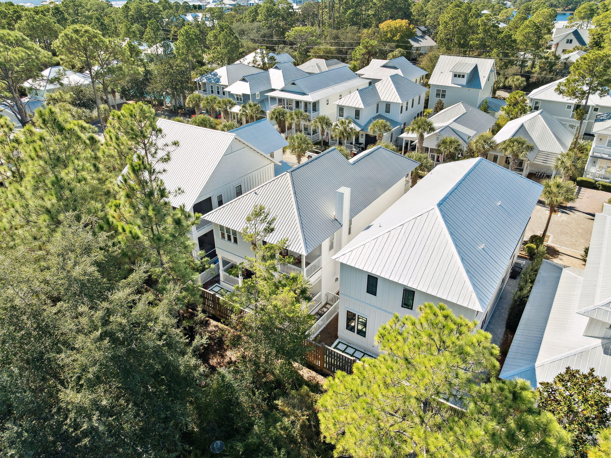 83 Eastern Lake Court Santa Rosa Beach, FL 32459 - Photo 5 of 40 an aerial view of a house with a yard and garden in the back