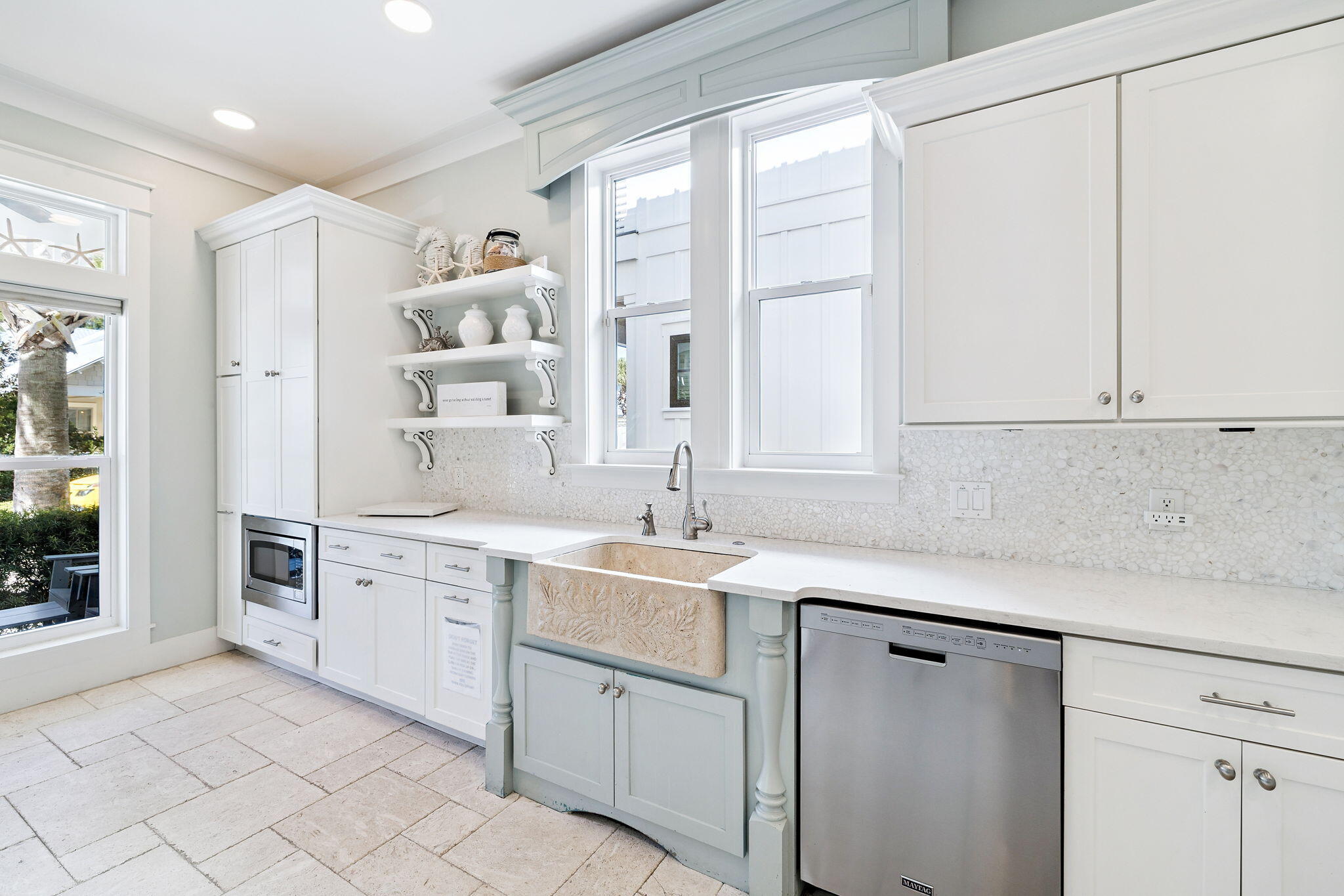 83 Eastern Lake Court Santa Rosa Beach, FL 32459 - Photo 10 of 40 a kitchen with white cabinets and sink