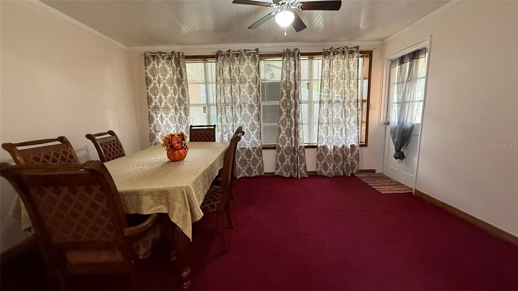 5754 9th Street Zephyrhills, FL 33542 - Photo 15 of 25 a view of a dining room with furniture window and outside view