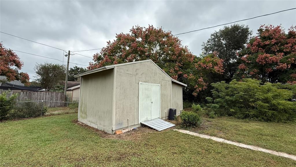 5754 9th Street Zephyrhills, FL 33542 - Photo 21 of 25 a backyard of a house with lots of green space