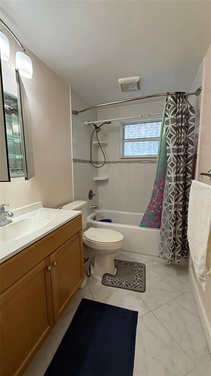 5754 9th Street Zephyrhills, FL 33542 - Photo 9 of 25 a bathroom with a sink a toilet and mirror