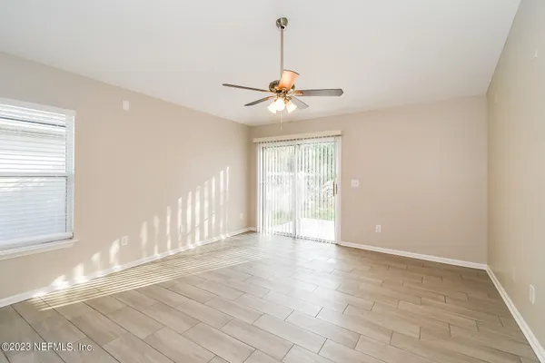 a view of an empty room with a window