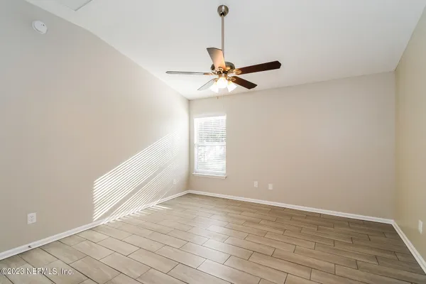 a view of an empty room with a window