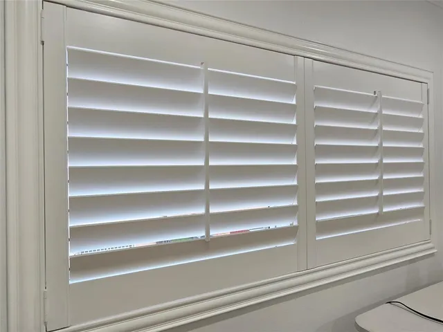 a bathroom with a sink vanity mirror and shower