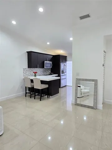 a room with furniture and a flat screen tv