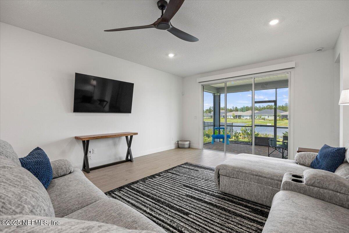 50 Dollar Court St. Augustine, FL 32092 - Photo 17 of 55 a living room with furniture and a flat screen tv