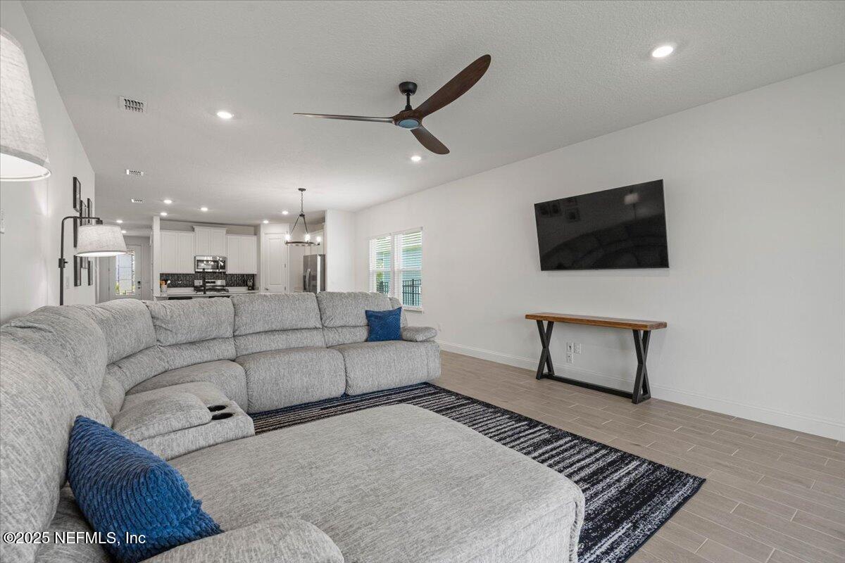 50 Dollar Court St. Augustine, FL 32092 - Photo 20 of 55 a living room with furniture and a flat screen tv