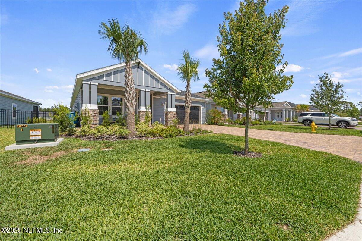 50 Dollar Court St. Augustine, FL 32092 - Photo 2 of 55 a front view of a house with a yard