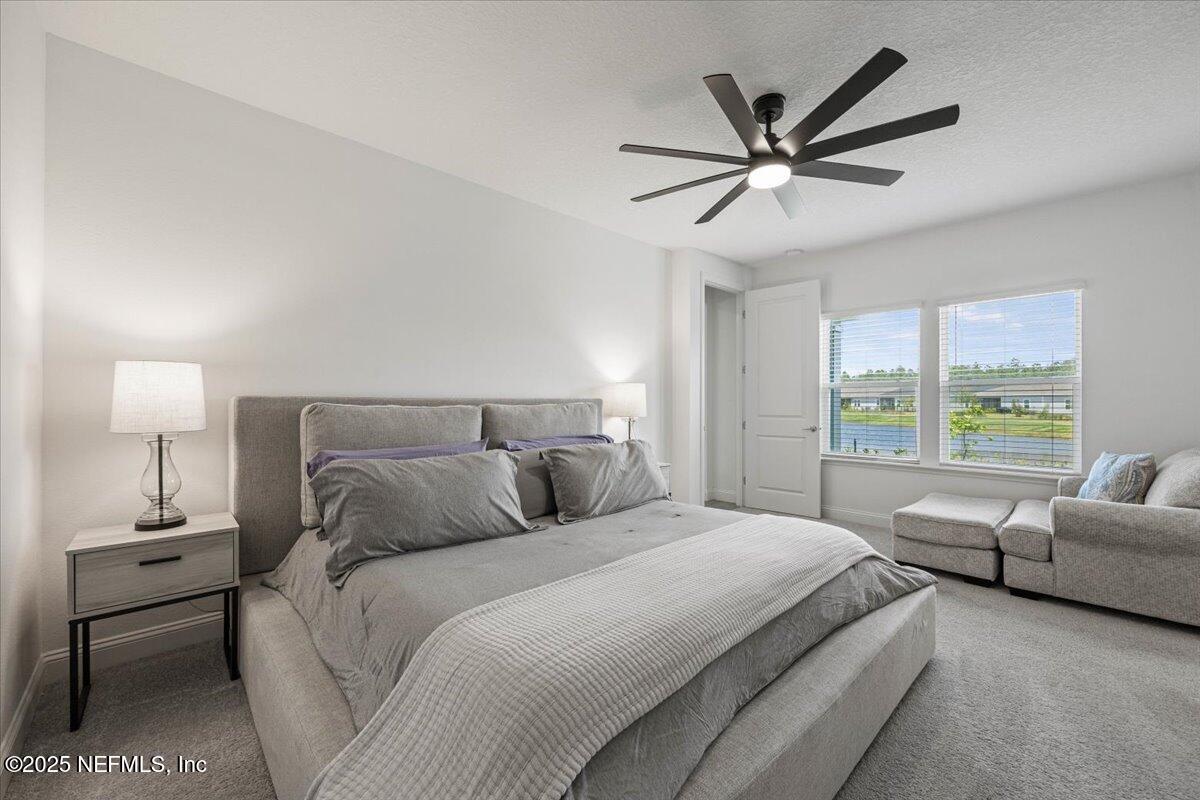 50 Dollar Court St. Augustine, FL 32092 - Photo 23 of 55 a bedroom with a bed and a couch