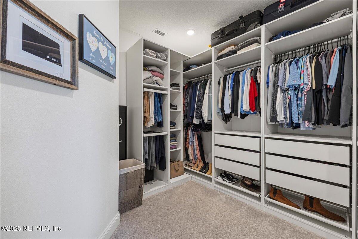 50 Dollar Court St. Augustine, FL 32092 - Photo 26 of 55 a view of walk in closet with clothes