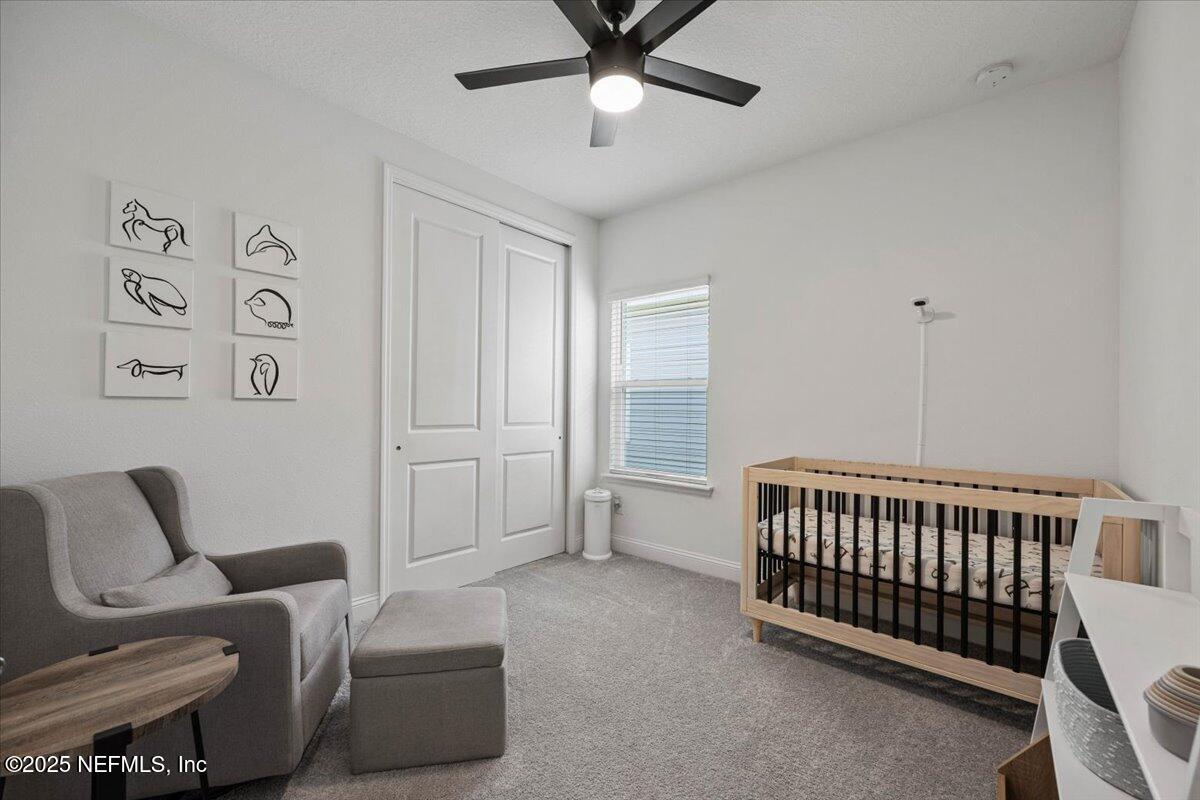 50 Dollar Court St. Augustine, FL 32092 - Photo 27 of 55 a bedroom with furniture and a window