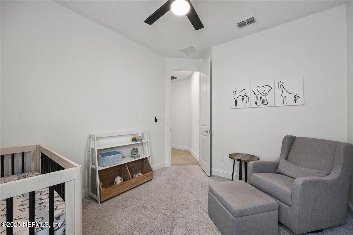 50 Dollar Court St. Augustine, FL 32092 - Photo 28 of 55 a living room with furniture and a ceiling fan