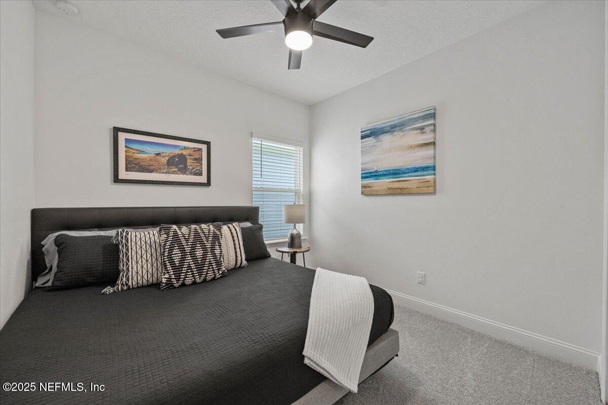 50 Dollar Court St. Augustine, FL 32092 - Photo 29 of 55 a bedroom with a bed and window