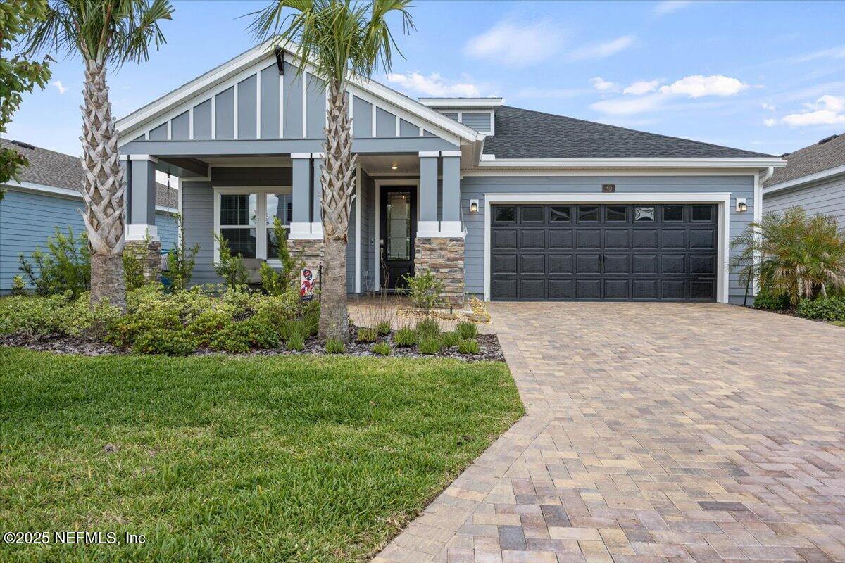 50 Dollar Court St. Augustine, FL 32092 - Photo 3 of 55 a front view of a house with a yard and garage