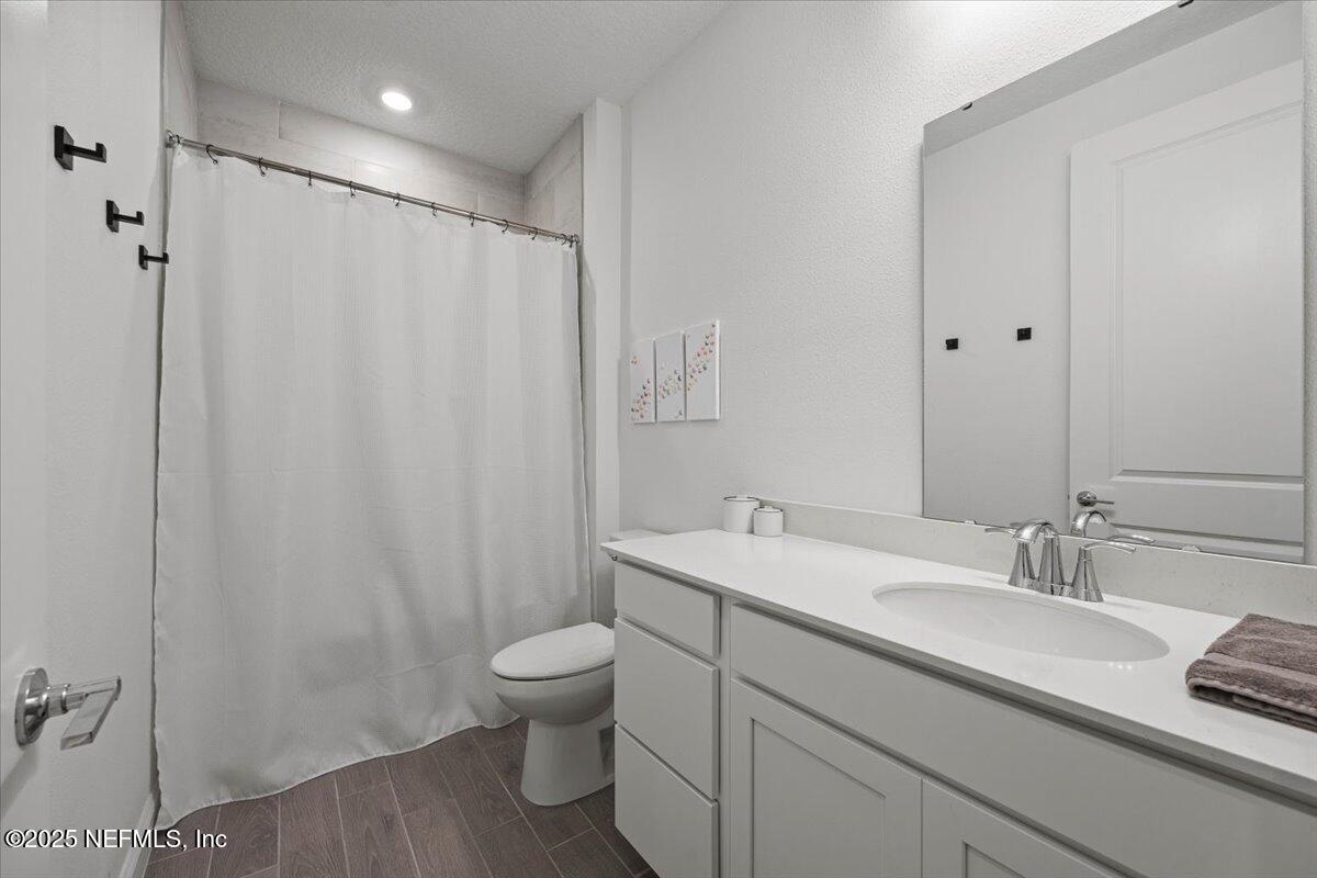 50 Dollar Court St. Augustine, FL 32092 - Photo 33 of 55 a bathroom with a sink a toilet and shower