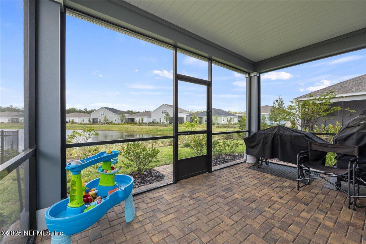 50 Dollar Court St. Augustine, FL 32092 - Photo 35 of 55 a living room filled with furniture and a floor to ceiling window