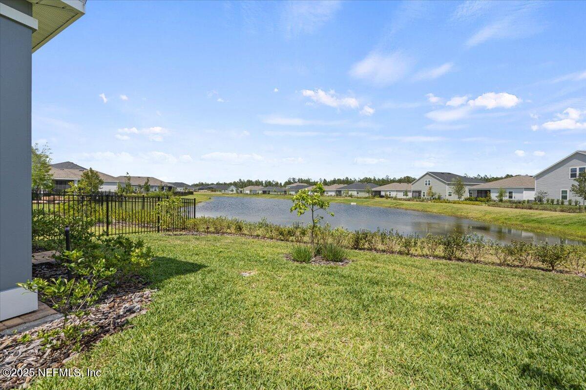 50 Dollar Court St. Augustine, FL 32092 - Photo 37 of 55 a view of a lake with houses in the back